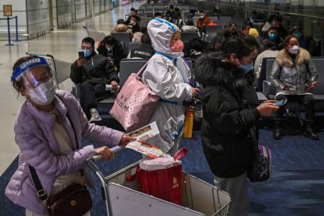 Matkustajia Shanghain kansainvälisellä lentokentällä 3. tammikuuta.